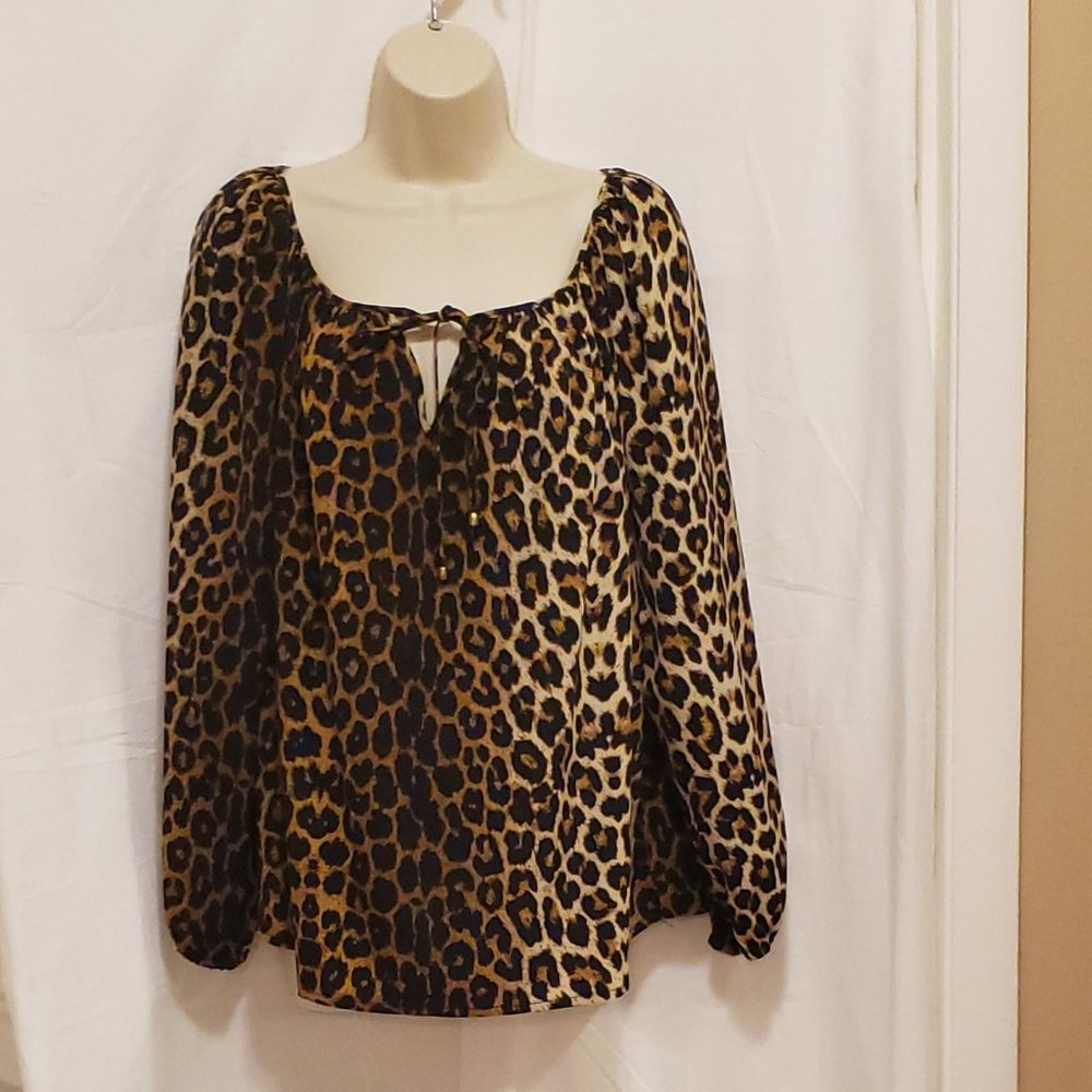 Leopard blouse with front ties and key hole back. size medium
